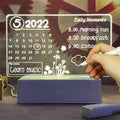 Creative Writing Board Lamp - Calendar Shape, Front view with doodles, turned on.